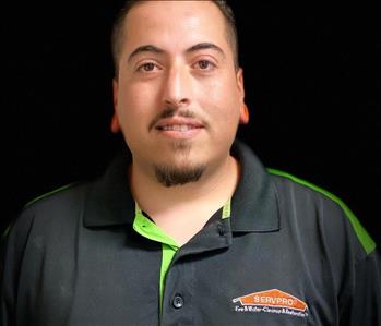 male employee in dark background profile picture