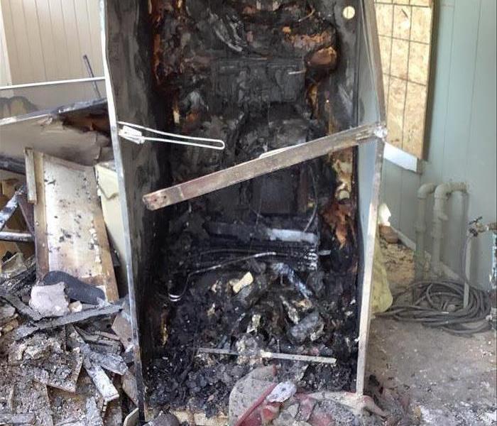refrigerator that caught fire and completely burnt
