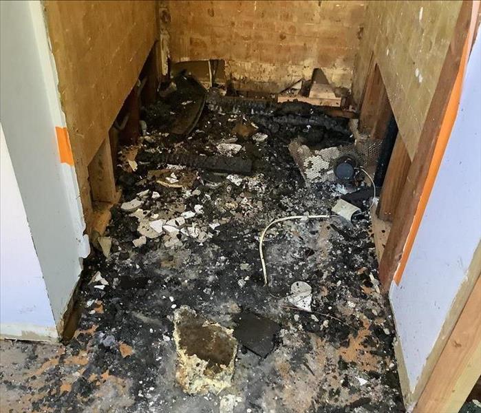 Gutted bathroom due to fire damage